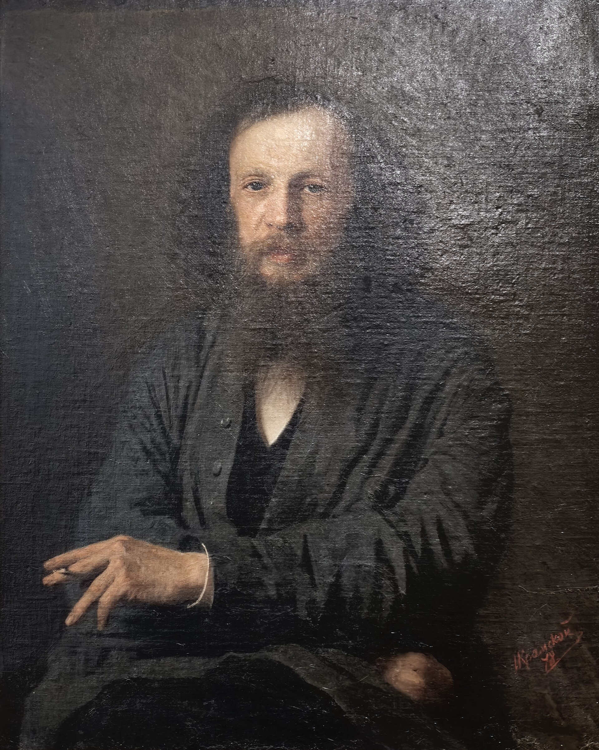 Retrato al óleo de Dmitri Mendeléiev, con barba y melena larga, sentado