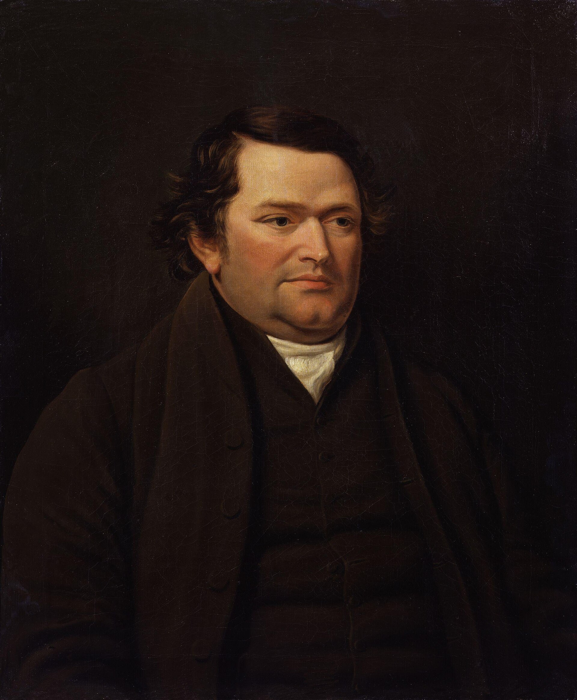 Retrato al óleo de un hombre corpulento de mediana edad con el pelo oscuro, patillas, chaqueta marrón oscura y cuello blanco, sobre fondo oscuro