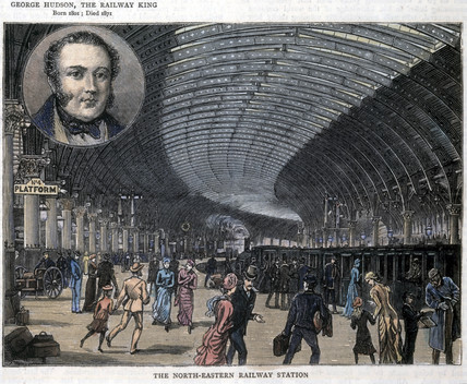 Litografía coloreada del siglo XIX con el interior de una gran estación de ferrocarril con bóveda de hierro y viajeros en el andén, y en un medallón arriba a la izquierda el retrato de un hombre con patillas