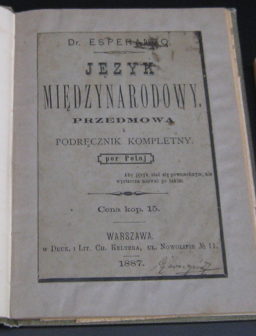 Portada de un pequeño libro antiguo, con el título en polaco en letras grandes y la fecha de 1887 al pie
