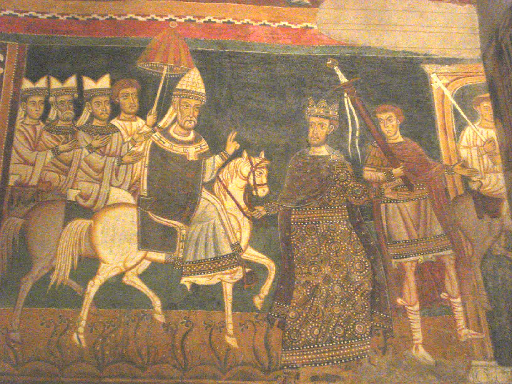 Fresco medieval de colores terrosos con un papa a caballo bajo un parasol, seguido de clérigos, y un emperador coronado que camina delante sujetando las riendas