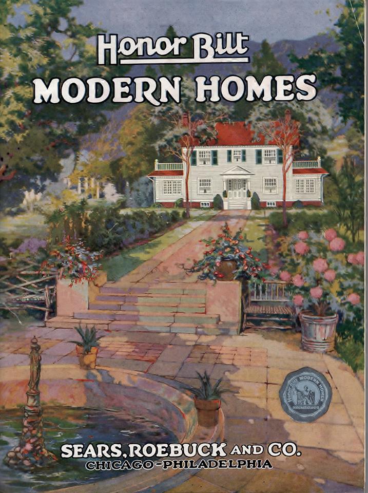 Portada ilustrada de 1922 de un catálogo de casas prefabricadas, con una vivienda blanca rodeada de jardín y el rótulo «Modern Homes»